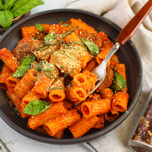 Creamy Roasted Red Pepper Pasta with Spicy Vegan Sausage & Cashew Parm - Uprise Foods